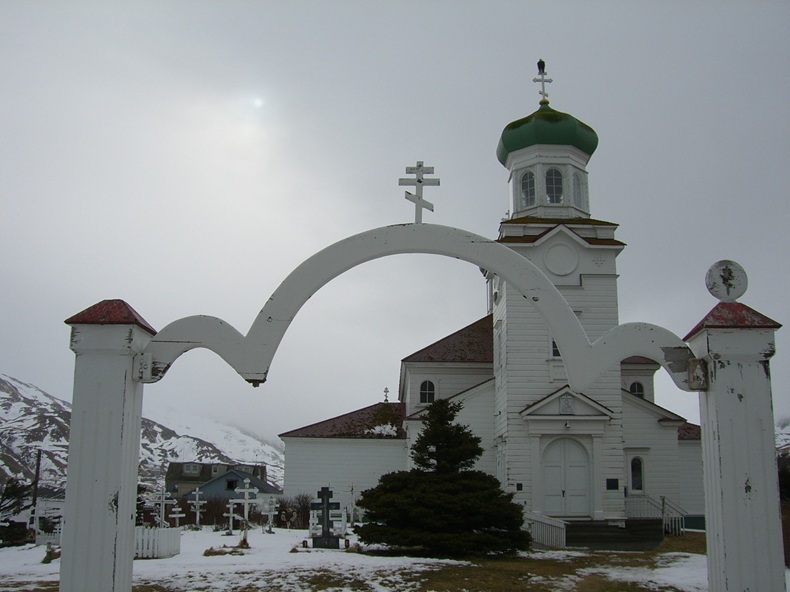 a wooden church with an onion dome