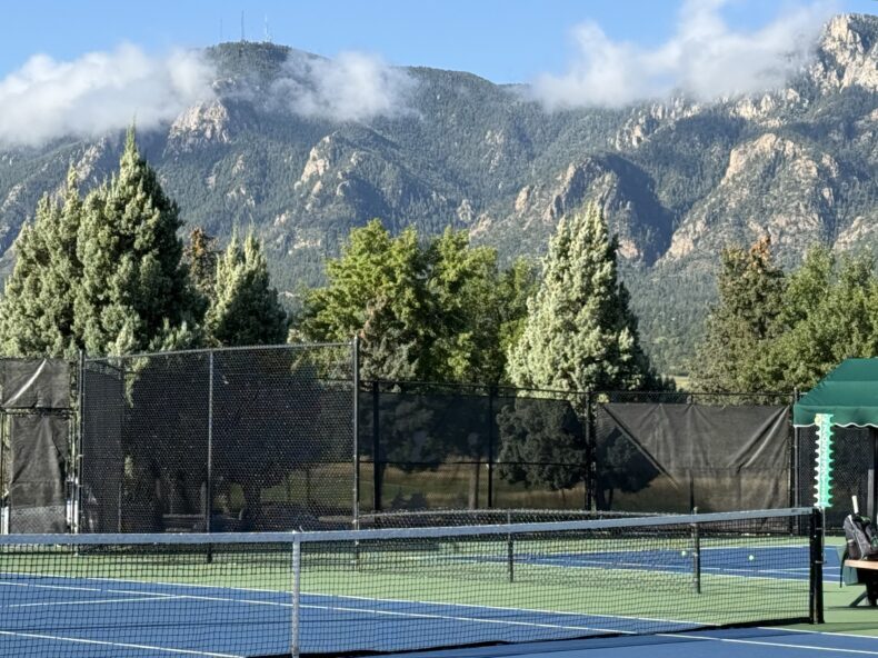 tennis courts in front of Cheyenne Mountain
